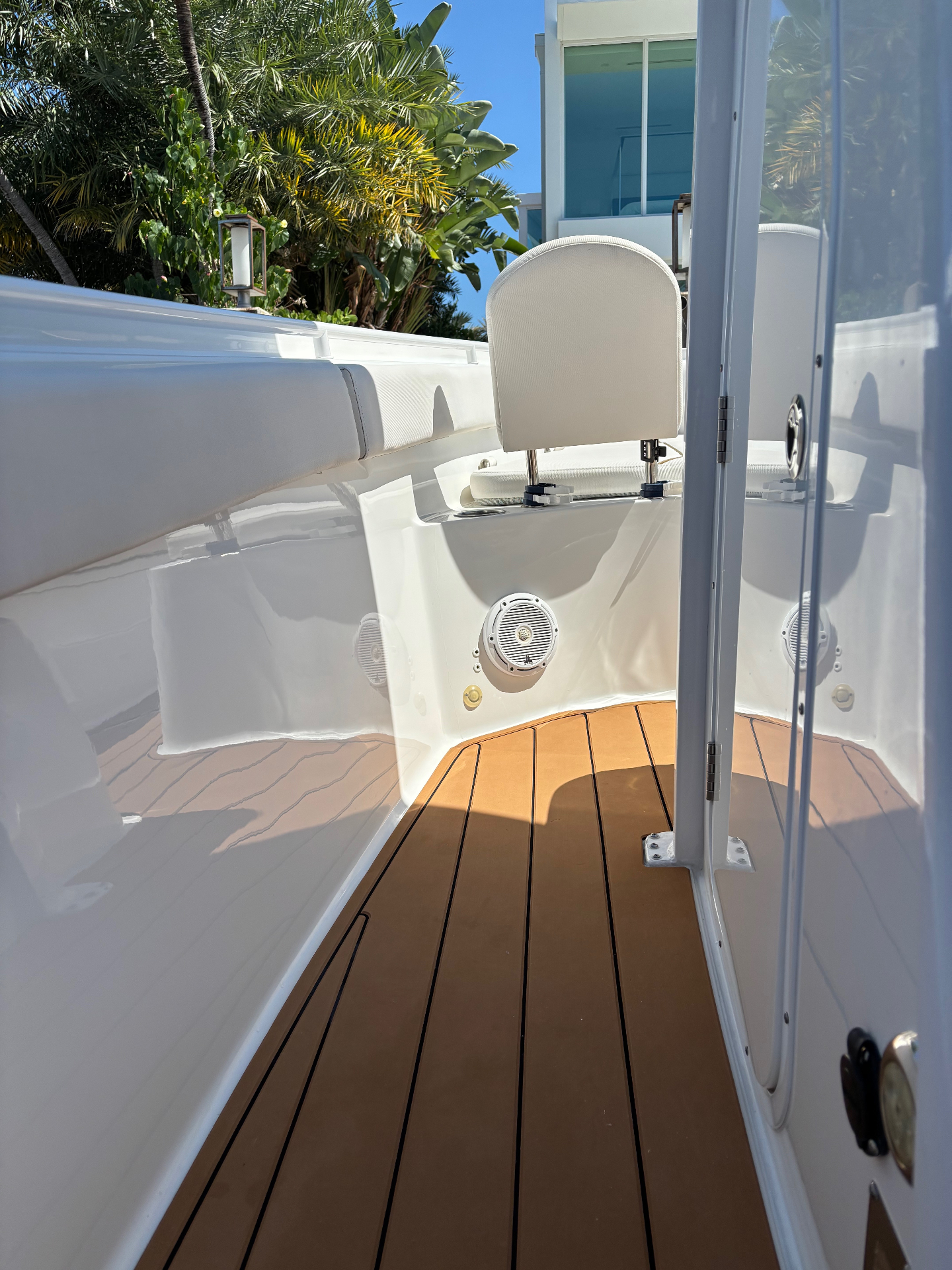 Teak decking restored and surrounding gelcoat polished to a deep shine.